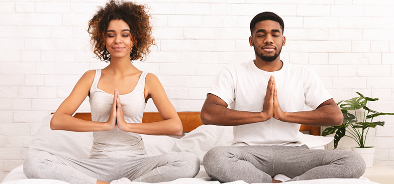 a man and woman meditate