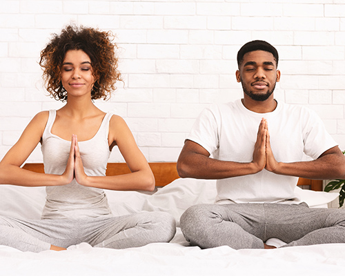 a man and woman meditate