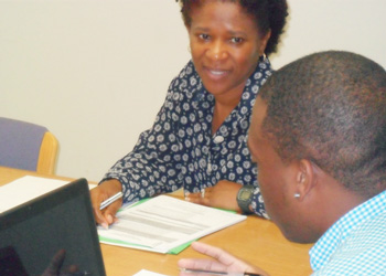 A woman discusses a document