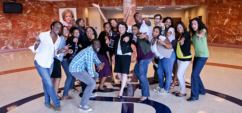 a group of students smile at the camera