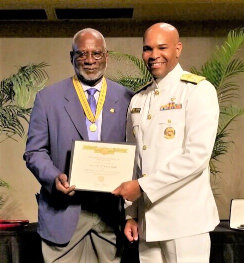 David Satcher receives an award presented by the Surgeon General