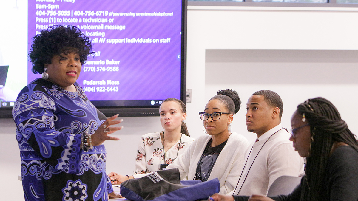 a group of Physician Assistant Program students listen to a presenter