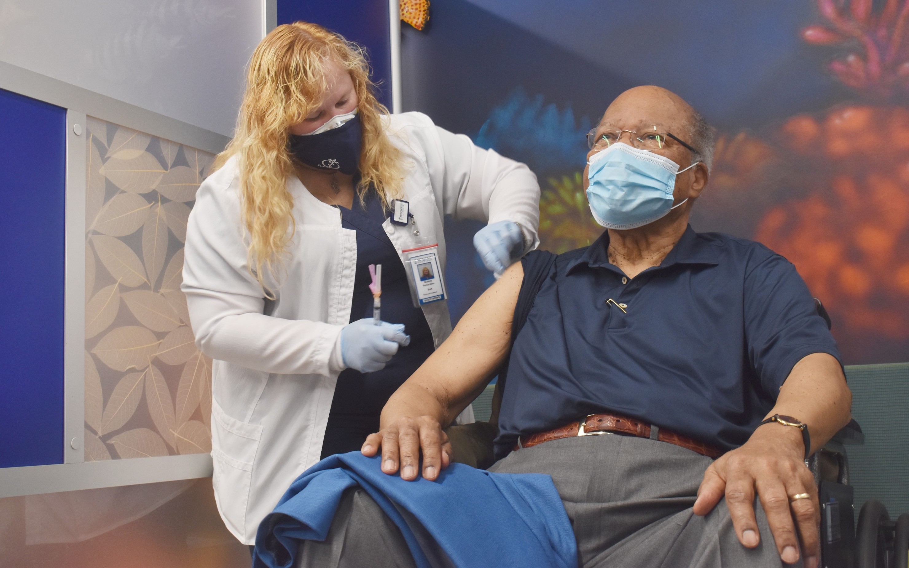 Andrew Young receiving a vaccination