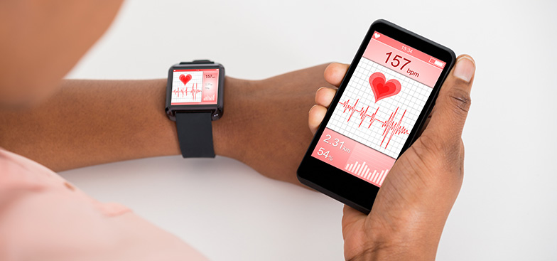 a person holds a phone showing a health app connected to a smart watch