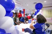 Youth from the Villages at Carver neighborhood register for Community Engagement Day 2018