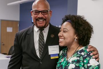 a man and woman smiling