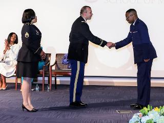 Military officers shake hands for Class Day 2019