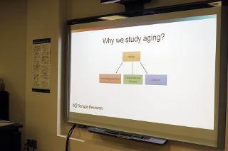 A presentation slide that shows 'Why we study aging'