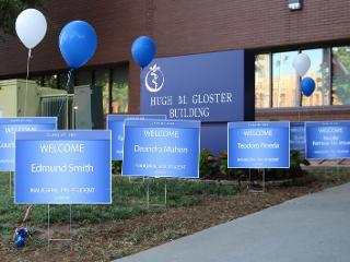 a group of yard signs welcoming each student by name