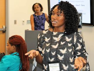 a woman talks to the class