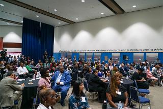 an audience sitting in a large room