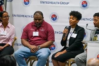 a woman gives a comment during a panel