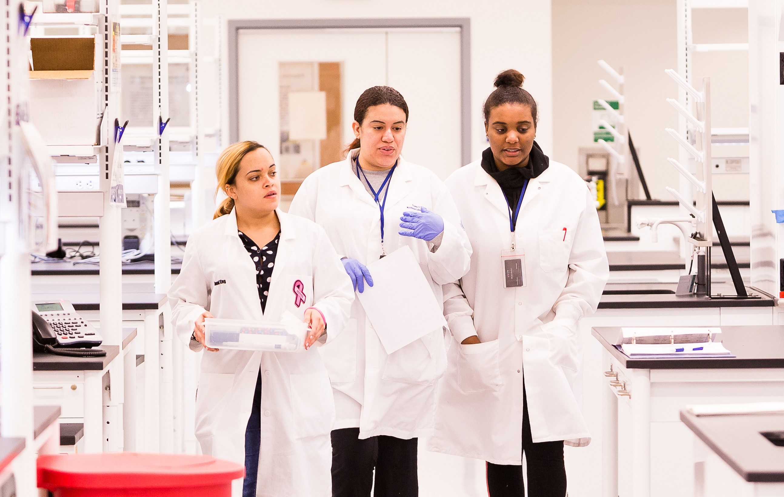 GEBS students walking through a lab